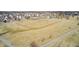 An aerial view of a neighborhood with a community field for soccer or other sports at 5524 Goodwin St, Indianapolis, IN 46234