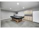 Finished basement including a pool table with a black cover, cabinetry, and a dartboard at 5524 Goodwin St, Indianapolis, IN 46234