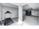 Open basement featuring exercise equipment including a trampoline, treadmill, and shelving at 5524 Goodwin St, Indianapolis, IN 46234