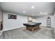 Finished basement featuring a pool table, dart board, and additional storage space at 5524 Goodwin St, Indianapolis, IN 46234
