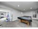 Carpeted basement featuring a pool table, and additional sitting area at 5524 Goodwin St, Indianapolis, IN 46234