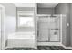 Bright bathroom features a soaking tub and a separate shower at 5524 Goodwin St, Indianapolis, IN 46234
