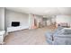 Expansive bonus room with TV, comfortable seating, and open layout for versatile use and customization at 5524 Goodwin St, Indianapolis, IN 46234