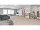 Spacious bonus room with cozy seating, a TV, natural light, and ample storage for recreation at 5524 Goodwin St, Indianapolis, IN 46234