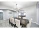 Open concept dining room with seating for eight and views of the living space at 5524 Goodwin St, Indianapolis, IN 46234