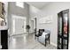 Inviting foyer boasts soaring ceilings, neutral walls, hardwood floors and an abundance of natural light at 5524 Goodwin St, Indianapolis, IN 46234