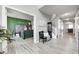 Spacious hallway featuring hardwood floors, neutral walls, decor and offering access to other rooms at 5524 Goodwin St, Indianapolis, IN 46234