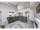 Spacious living room featuring hardwood floors, neutral walls and stylish furniture with easy access to other rooms at 5524 Goodwin St, Indianapolis, IN 46234