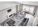 Open-concept living room with large windows, modern decor, a fireplace, and comfortable seating area at 5524 Goodwin St, Indianapolis, IN 46234