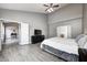 Spacious main bedroom with ceiling fan, walk-in closet, and view to breakfast nook at 5524 Goodwin St, Indianapolis, IN 46234