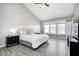 Vaulted ceiling main bedroom with ceiling fan and large windows at 5524 Goodwin St, Indianapolis, IN 46234