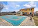 Backyard with a covered pool and outdoor furniture. The home has a large deck at 5529 W 29Th Pl, Indianapolis, IN 46224