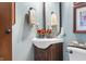 Charming powder room featuring a rustic vanity with a vessel sink and tasteful decor at 5529 W 29Th Pl, Indianapolis, IN 46224