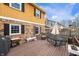 Large wooden deck featuring outdoor seating, a grill, and views of the backyard at 5529 W 29Th Pl, Indianapolis, IN 46224