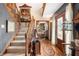 Elegant foyer showcasing a wooden staircase, hardwood floors, and decorative accents, creating a grand entrance at 5529 W 29Th Pl, Indianapolis, IN 46224