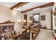 Well-lit hallway with chandelier, wooden banister, and access to various rooms in the house at 5529 W 29Th Pl, Indianapolis, IN 46224