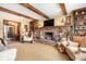 Cozy living room featuring a brick fireplace, built-in shelving, and comfortable seating, creating a warm and inviting atmosphere at 5529 W 29Th Pl, Indianapolis, IN 46224