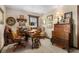 Home office with a wooden desk, vintage decor, and natural lighting at 5529 W 29Th Pl, Indianapolis, IN 46224