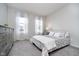 Bedroom featuring neutral paint, two windows with sheer curtains and a comfortable bed at 568 Harstad Blvd, Westfield, IN 46074