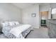 Comfortable bedroom featuring neutral walls and carpet with a decorative bed and dresser at 568 Harstad Blvd, Westfield, IN 46074