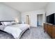 Serene bedroom with soft hues, a spacious layout, and convenient access to the ensuite bathroom at 568 Harstad Blvd, Westfield, IN 46074