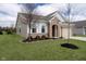 Side view of a lovely home with a manicured lawn and tidy landscaping at 568 Harstad Blvd, Westfield, IN 46074
