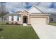 Charming brick home featuring an attached two-car garage and a well-manicured front lawn at 568 Harstad Blvd, Westfield, IN 46074
