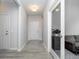 Bright hallway with wood flooring, and an office space with a glass door at 568 Harstad Blvd, Westfield, IN 46074