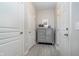Hallway featuring neutral paint, grey wood look floors, and storage at 568 Harstad Blvd, Westfield, IN 46074