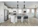 Stylish kitchen island with bar seating and modern pendant lighting at 568 Harstad Blvd, Westfield, IN 46074