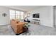 Inviting living room featuring a large window, neutral colors, and a cozy seating area at 568 Harstad Blvd, Westfield, IN 46074