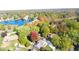 Beautiful aerial of a home near the lake with colorful fall trees at 5704 Springhollow Ct, Avon, IN 46123