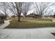 Large property with a sprawling backyard featuring a house with updated landscaping and walking path at 5704 Springhollow Ct, Avon, IN 46123
