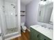 Bathroom featuring tiled shower, stone floors and modern vanity at 5704 Springhollow Ct, Avon, IN 46123