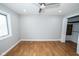 Bright and airy bedroom boasts hardwood floors, ceiling fan, and closet, offering comfort at 5704 Springhollow Ct, Avon, IN 46123