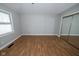 Spacious bedroom featuring laminated floors and a mirrored closet at 5704 Springhollow Ct, Avon, IN 46123