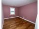 Bedroom with hardwood floors and a window at 5704 Springhollow Ct, Avon, IN 46123