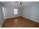 Bedroom featuring laminated floors, ceiling fan, and a window at 5704 Springhollow Ct, Avon, IN 46123