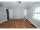 Bedroom featuring laminated floors and two doors at 5704 Springhollow Ct, Avon, IN 46123