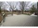 Large wood deck overlooking landscaped backyard, featuring rod iron railings and a firepit area at 5704 Springhollow Ct, Avon, IN 46123