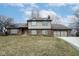 Charming two-story brick home with a well-manicured lawn and attached two car garage at 5704 Springhollow Ct, Avon, IN 46123