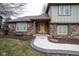 Welcoming front entrance features a beautifully crafted wooden door with sidelights and a manicured garden at 5704 Springhollow Ct, Avon, IN 46123
