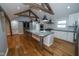 Spacious open concept kitchen has center island with granite countertops and stainless steel appliances at 5704 Springhollow Ct, Avon, IN 46123
