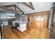 Open-concept kitchen leads into dining area with views from the windows and a sliding barn door at 5704 Springhollow Ct, Avon, IN 46123