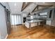 Spacious open-concept kitchen features large island, stainless appliances, and hardwood flooring at 5704 Springhollow Ct, Avon, IN 46123