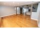 Spacious living area boasts hardwood floors, rustic beam accents, and an open layout to the kitchen at 5704 Springhollow Ct, Avon, IN 46123