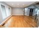 Inviting living room with abundant natural light, hardwood flooring, and rustic wooden beam accents at 5704 Springhollow Ct, Avon, IN 46123