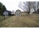 Backyard showcasing two neutral-colored sheds with fencing around the perimeter at 5704 Springhollow Ct, Avon, IN 46123