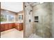 Bathroom featuring shower, double vanity with marble countertop, mirror, and decorative lighting at 6002 Turtle Bay Pkwy, Columbus, IN 47201