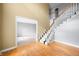 Spacious foyer with hardwood floors, a staircase, and views into adjacent rooms at 6002 Turtle Bay Pkwy, Columbus, IN 47201